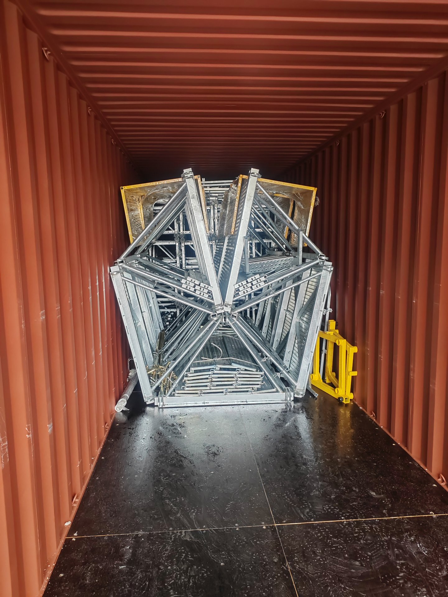 Mast sections loaded into a shipping container